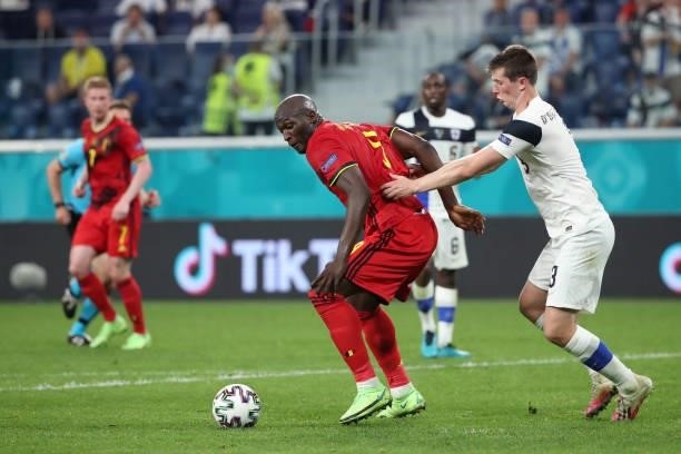Romelu Lukaku of Belgium battles for the ball with Daniel O'Shaughnessy of Finland during the UEFA Euro 2020 Championship Group B match between...