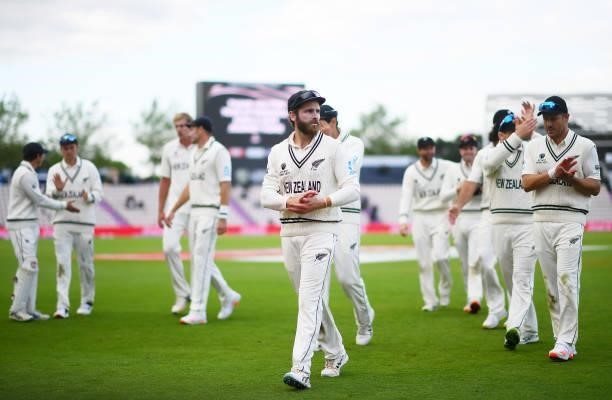Kane Williamson of New Zealand leads his side off at close of play on Day 5 of the ICC World Test Championship Final between India and New Zealand at...