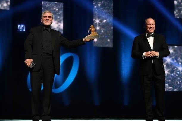Tcheky Karyo poses on stage with a Crystal Nymph next to Prince Albert II of Monaco during the closing ceremony of the 60th Monte Carlo TV Festival...