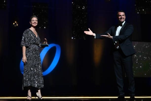 Anna Marsh poses with the Best Serie Golden Nymph award for the serie « It’s a sin » next to jury member Arnaud Ducret during the closing ceremony of...