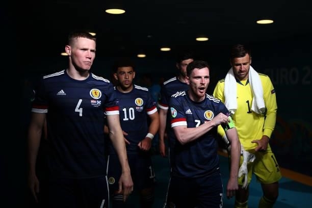 Andrew Robertson of Scotland adjusts his captains armband as he leads the team out for the second half during the UEFA Euro 2020 Championship Group D...