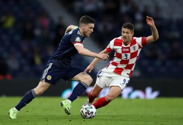 Andrew Robertson of Scotland controls the ball from Andrej Kramaric of Croatia during the UEFA Euro 2020 Championship Group D match between Croatia...