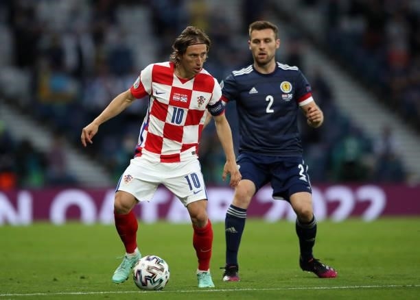 Luka Modric of Croatia controls the ball from Stephen O'Donnell of Scotland during the UEFA Euro 2020 Championship Group D match between Croatia and...