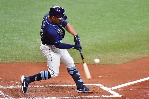 Francisco Mejia of the Tampa Bay Rays hits a two-RBI single against the Boston Red Sox in the first inning at Tropicana Field on June 22, 2021 in St...