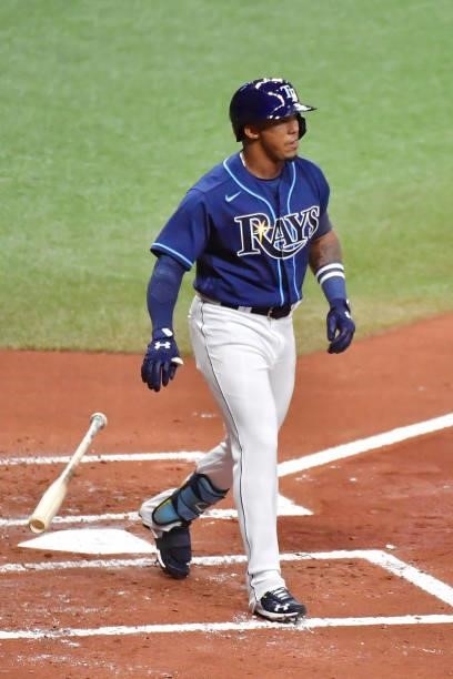 Wander Franco of the Tampa Bay Rays drops his bat after being walked in his Major League debut during the first inning against the Boston Red Sox at...