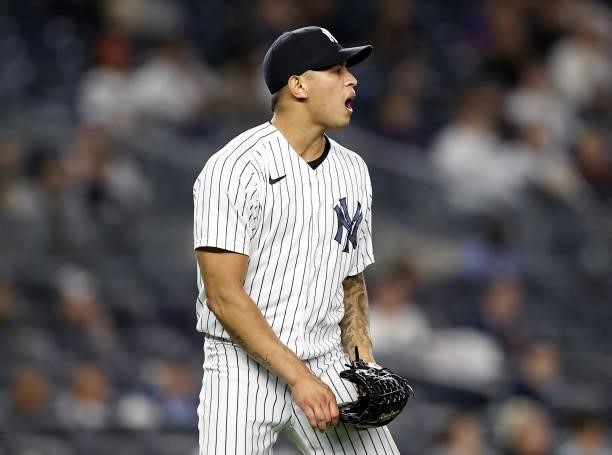 Jonathan Loaisiga of the New York Yankees reacts after Kansas City Royals scores in the eighth inning at Yankee Stadium on June 22, 2021 in the Bronx...