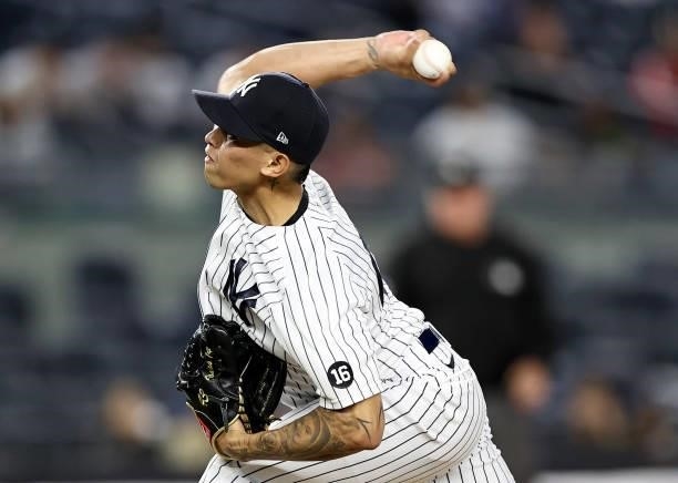 Jonathan Loaisiga of the New York Yankees delivers a pitch in the eighth inning against the Kansas City Royals at Yankee Stadium on June 22, 2021 in...