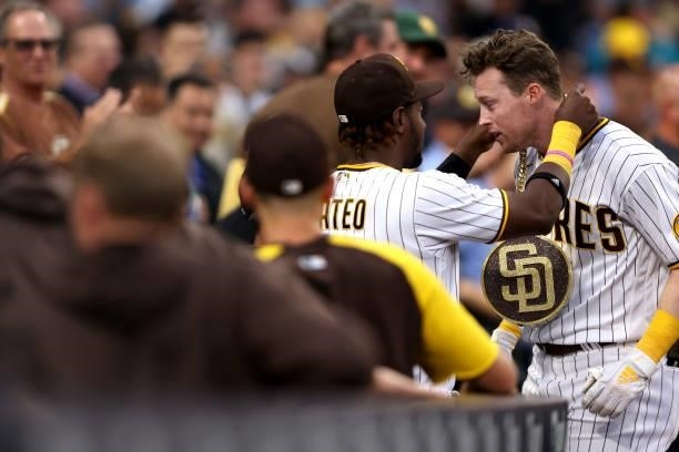 Jorge Mateo congratulates Jake Cronenworth of the San Diego Padres after his two-run homerun during the first inning of a game against the Los...