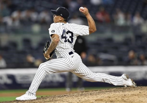 Jonathan Loaisiga of the New York Yankees delivers a pitch in the eighth inning against the Kansas City Royals at Yankee Stadium on June 22, 2021 in...