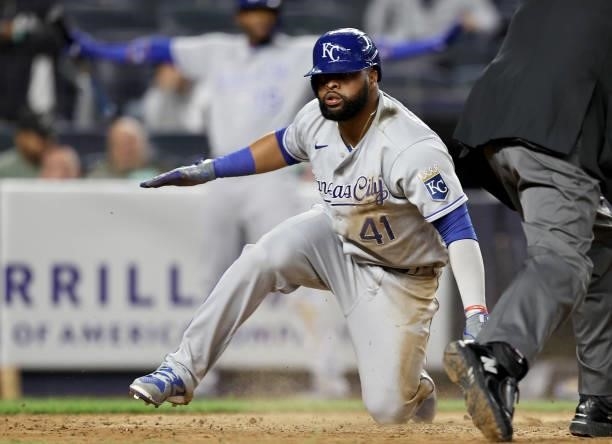 Carlos Santana of the Kansas City Royals is safe at home in the eighth inning against the New York Yankees at Yankee Stadium on June 22, 2021 in the...