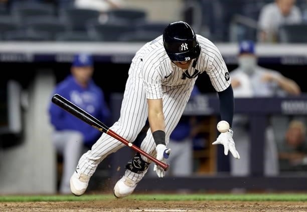 Gio Urshela of the New York Yankees is hit by a pitch in the seventh inning against the Kansas City Royals at Yankee Stadium on June 22, 2021 in the...