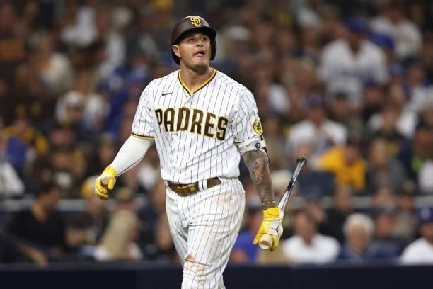 Manny Machado of the San Diego Padres returns to the dugout after striking out during the fourth inning of a game against the Los Angeles Dodgers at...