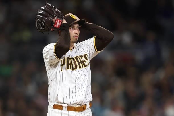 Blake Snell of the San Diego Padres looks on after allowing a single to AJ Pollock of the Los Angeles Dodgers during the fourth inning of a game at...