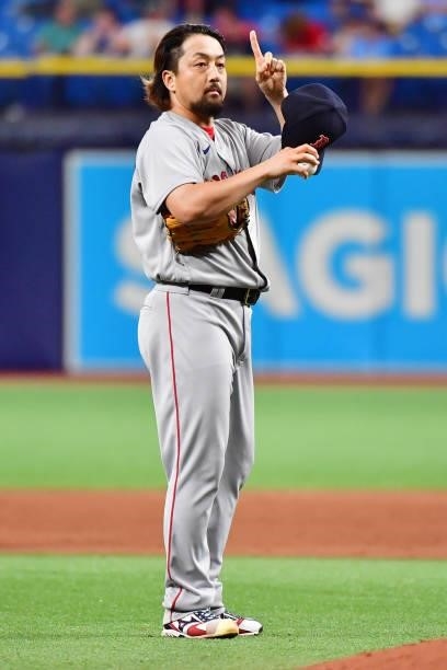 Hirokazu Sawamura of the Boston Red Sox signals to Christian Vazquez in the ninth inning against the Tampa Bay Rays at Tropicana Field on June 22,...