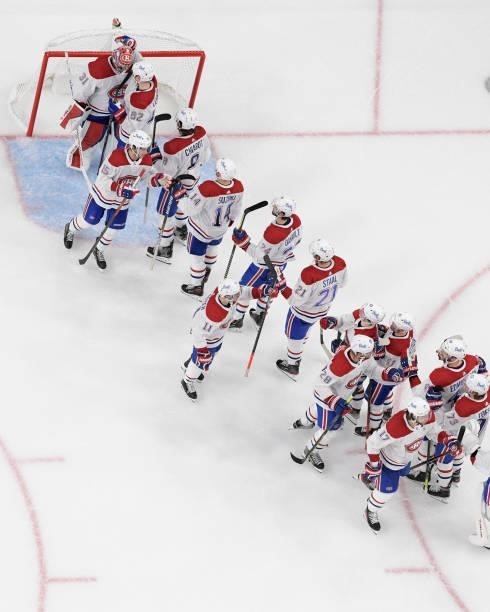 The Montreal Canadiens celebrate their 4-1 victory over the Vegas Golden Knights in Game Five of the Stanley Cup Semifinals at T-Mobile Arena on June...