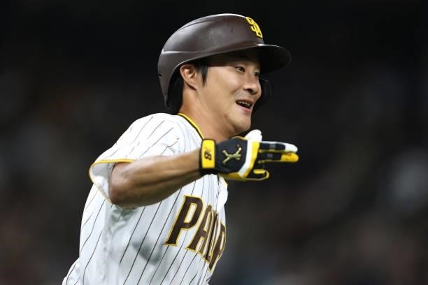 Ha-Seong Kim of the San Diego Padres reacts after hitting a solo homerun during the fifth inning of a game against the Los Angeles Dodgers at PETCO...