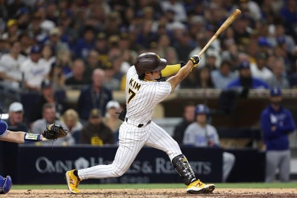 Ha-Seong Kim of the San Diego Padres hits a solo homerun during the fifth inning of a game against the Los Angeles Dodgers at PETCO Park on June 22,...