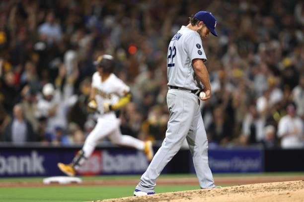 Clayton Kershaw of the Los Angeles Dodgers looks on after Ha-Seong Kim of the San Diego Padres hits a solo homerun during the fifth inning of a game...