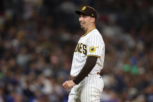 Blake Snell of the San Diego Padres reacts after throwing a ball to Justin Turner of the Los Angeles Dodgers during the fifth inning of a game at...