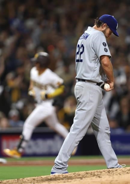 Clayton Kershaw of the Los Angeles Dodgers looks on after Ha-Seong Kim of the San Diego Padres hits a solo homerun during the fifth inning of a game...