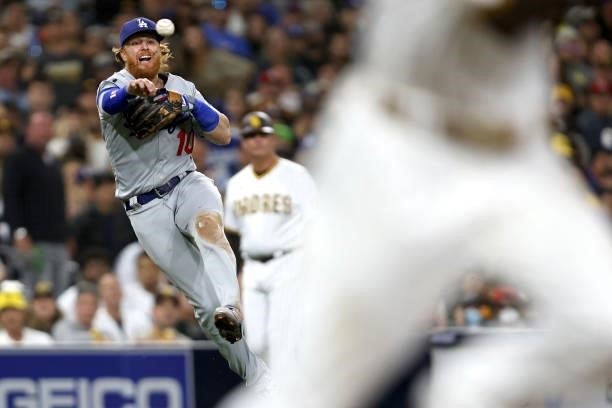 Justin Turner of the Los Angeles Dodgers is unable to throw out Wil Myers of the San Diego Padres on an infield single during the sixth inning of a...