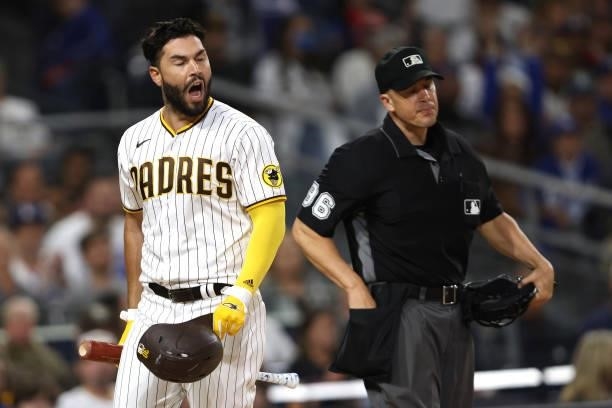 Eric Hosmer of the San Diego Padres yells at umpire Chris Segal after striking out during the sixth inning of a game against the Los Angeles Dodgers...