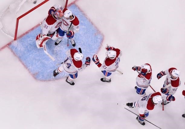 The Montreal Canadiens celebrate after defeating the Vegas Golden Knights in Game Five of the Stanley Cup Semifinals at T-Mobile Arena on June 22,...
