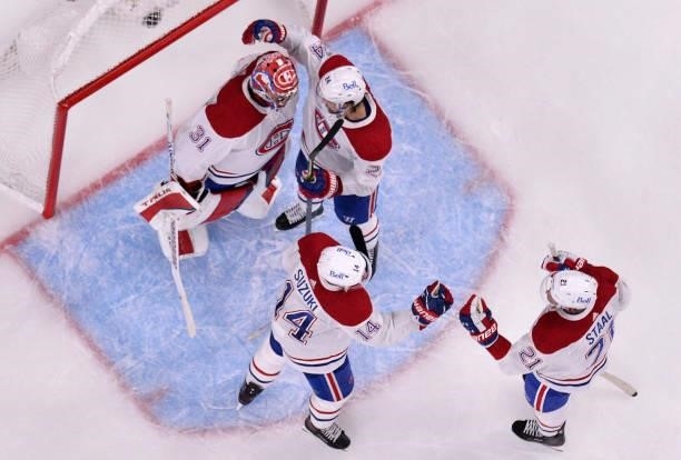 The Montreal Canadiens celebrate after defeating the Vegas Golden Knights in Game Five of the Stanley Cup Semifinals at T-Mobile Arena on June 22,...