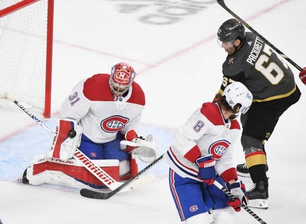 Carey Price of the Montreal Canadiens deflects a shot by Max Pacioretty of the Vegas Golden Knights during the third period in Game Five of the...