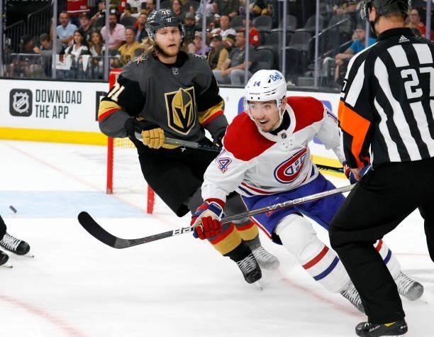 Nick Suzuki of the Montreal Canadiens reacts in front of William Karlsson of the Vegas Golden Knights after scoring an empty-net goal in the third...
