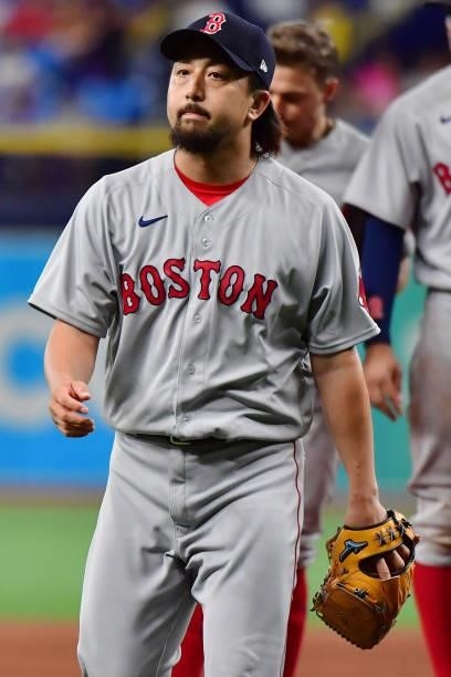 Hirokazu Sawamura of the Boston Red Sox looks on after being relieved in the ninth inning against the Tampa Bay Rays at Tropicana Field on June 22,...
