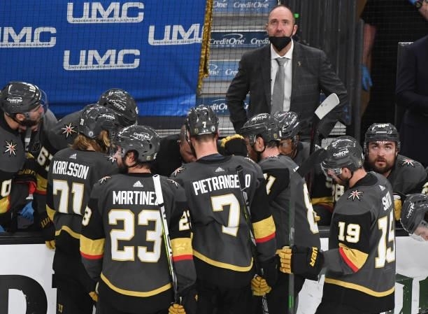 Head coach Peter DeBoer of the Vegas Golden Knights looks up at the scoreboard during a break in the action against the Montreal Canadiens during the...