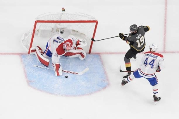 Carey Price of the Montreal Canadiens stops a shot by Reilly Smith of the Vegas Golden Knights while Joel Edmundson of the Montreal Canadiens assists...
