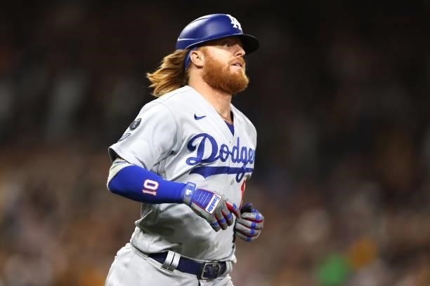 Justin Turner of the Los Angeles Dodgers looks on after flying out during the ninth inning of a game against the San Diego Padres at PETCO Park on...
