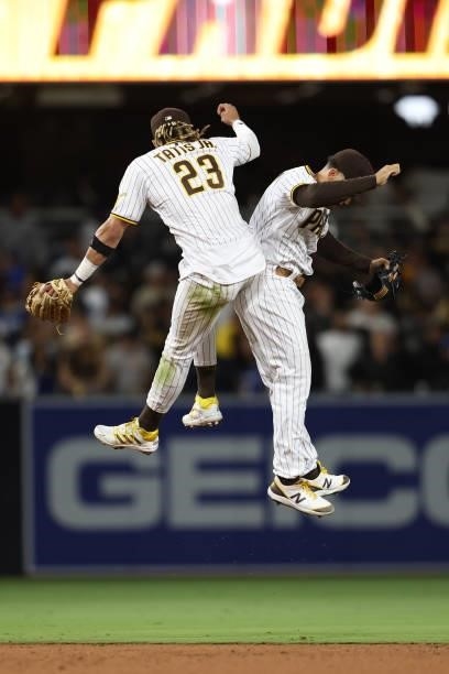 Trent Grisham and Fernando Tatis Jr. #23 of the San Diego Padres celebrate after defeating the Los Angeles Dodgers 3-2 in a game at PETCO Park on...