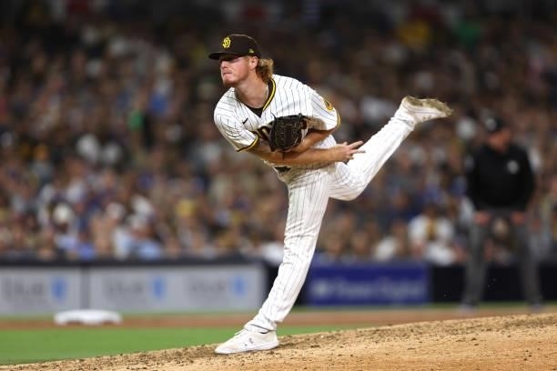 Mason Thompson of the San Diego Padres pitches in his major league debut during the eighth inning of a game against the Los Angeles Dodgers at PETCO...