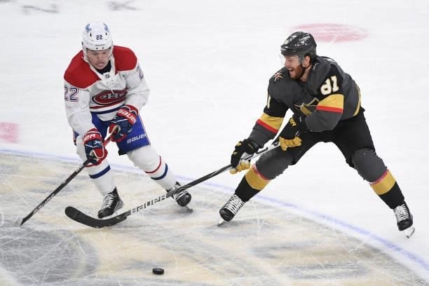 Cole Caufield of the Montreal Canadiens and Jonathan Marchessault of the Vegas Golden Knights fight for the puck during the first period in Game Five...