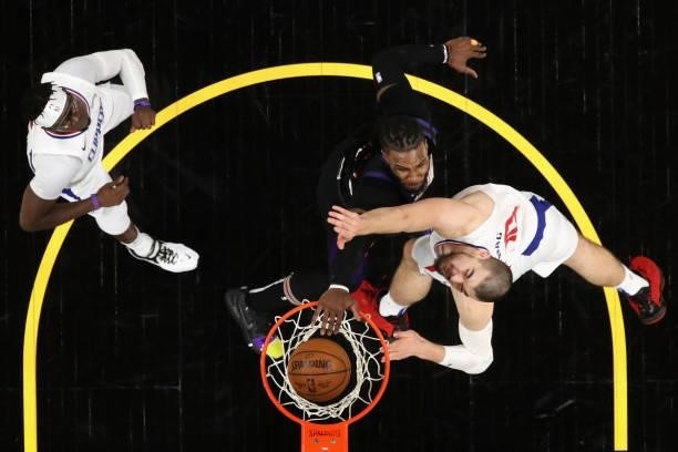 Jae Crowder of the Phoenix Suns slam dunks the ball over Ivica Zubac of the LA Clippers during the second half of game two of the Western Conference...