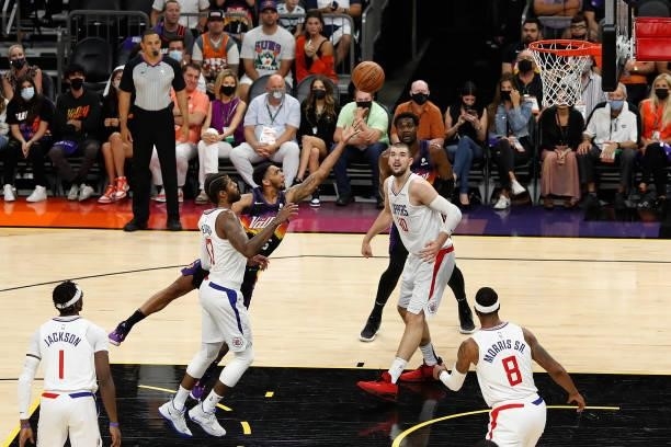 Cameron Payne of the Phoenix Suns puts up a shot past Paul George of the LA Clippers during the second half of game two of the Western Conference...