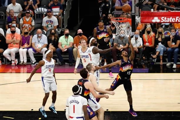 Cameron Payne of the Phoenix Suns lays up a shot past Patrick Beverley of the LA Clippers during the second half of game two of the Western...