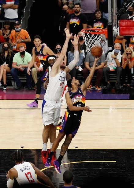 Cameron Payne of the Phoenix Suns lays up a shot past Ivica Zubac of the LA Clippers during the second half of game two of the Western Conference...
