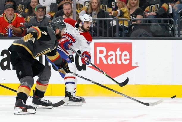 Phillip Danault of the Montreal Canadiens shoots under pressure from Alex Pietrangelo of the Vegas Golden Knights in the first period in Game Five of...