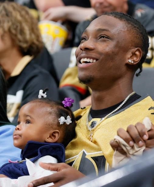 Wide receiver Henry Ruggs III of the Las Vegas Raiders and his daughter Kenzli Re'Nai Ruggs attend Game Five of the Stanley Cup Semifinals of the...