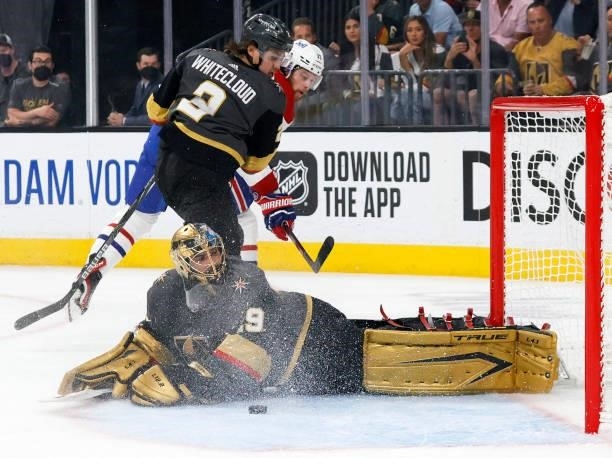 The puck gets away from Marc-Andre Fleury of the Vegas Golden Knights after he made a save against Josh Anderson of the Montreal Canadiens on a...