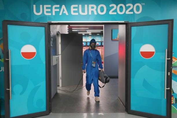 Member of staff disinfects the stadium prior to the UEFA Euro 2020 Championship Group E match between Sweden and Poland at Saint Petersburg Stadium...