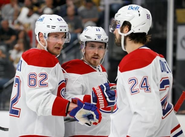 Artturi Lehkonen, Brendan Gallagher and Phillip Danault of the Montreal Canadiens talk during a stop in play in the second period of Game Five of the...