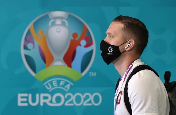 Piotr Zielinski of Poland is seen wearing a face mask as he arrives at the stadium prior to the UEFA Euro 2020 Championship Group E match between...