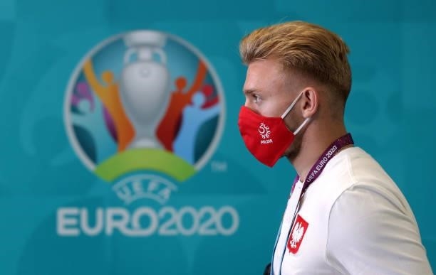 Kamil Jozwiak of Poland is seen wearing a face mask as he arrives at the stadium prior to the UEFA Euro 2020 Championship Group E match between...