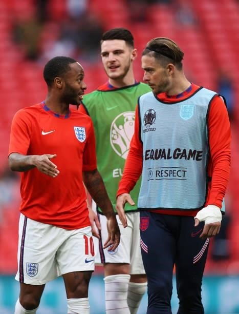 Raheem Sterling and Jack Grealish of England warm up prior to the UEFA Euro 2020 Championship Group D match between Czech Republic and England at...