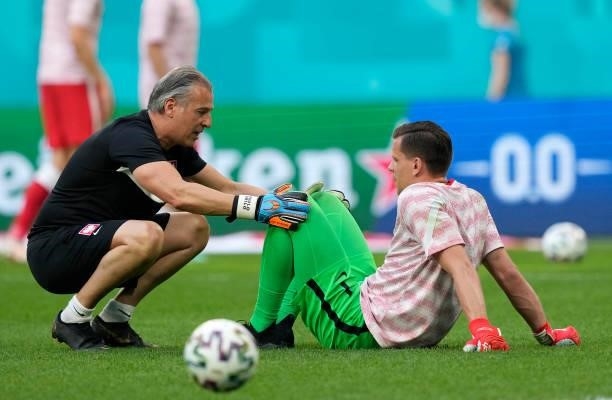 Wojciech Szczesny of Poland interacts with Goalkeeper Coach, Paulo Grilo during the warm up prior to the UEFA Euro 2020 Championship Group E match...
